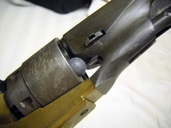 detail, Colt 1851 loading: ball in place at chamber mouth